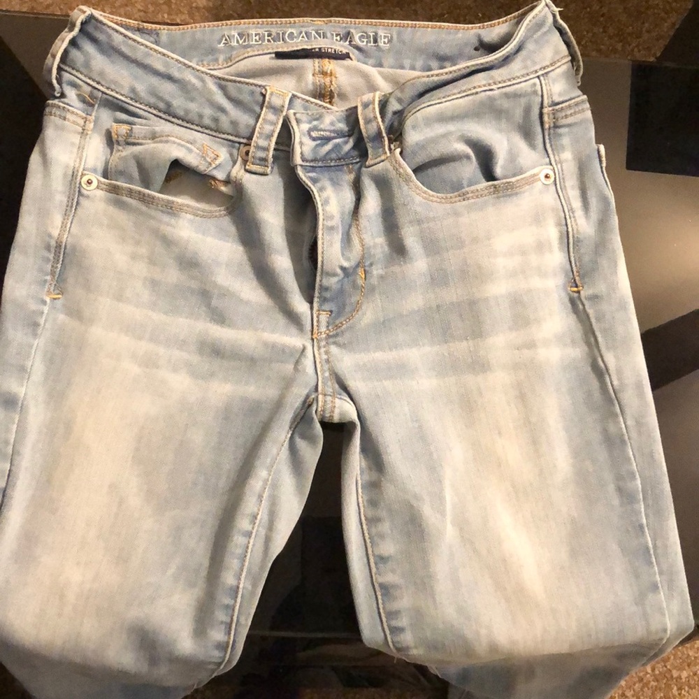 Light wash, light distressed, boot cut AE jeans